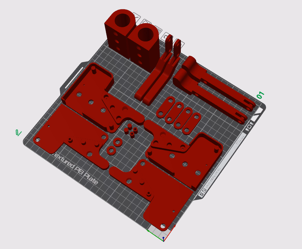 QuickClamp components arranged on a 3D printer build plate
